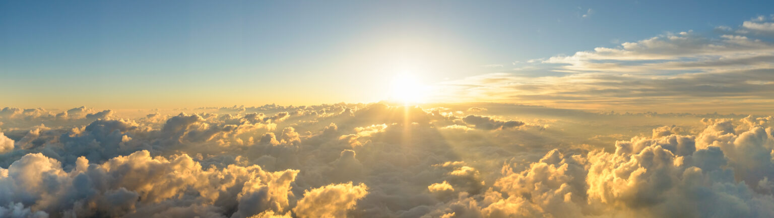 Sun peeking over clouds